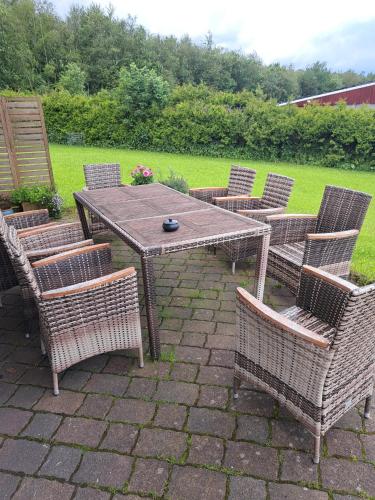 a wooden table and chairs with a table and chairs at Haus Eufalia in Blankenheim