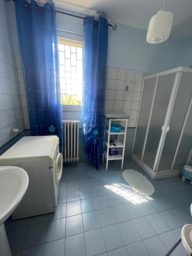 a bathroom with a bed and a shower and a sink at La Locanda Del Re in Villalfonsina
