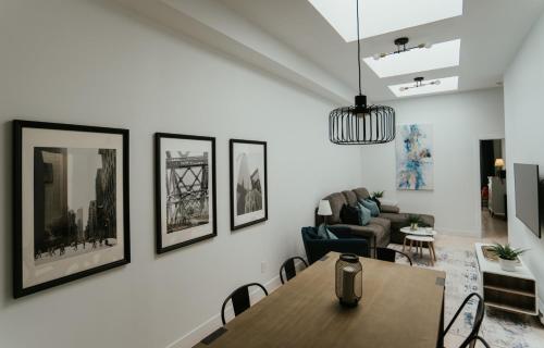 a living room with a table and a couch at Welcoming and Light Filled 2bdr Apartment in Montréal