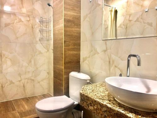 a bathroom with a sink and a toilet at Maria Garden in Kranevo