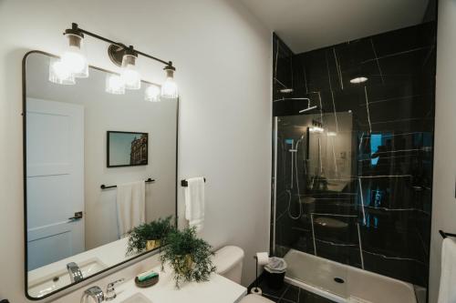 a bathroom with a sink and a shower at New Spacious and Cozy 2bdr Apartment in Montréal