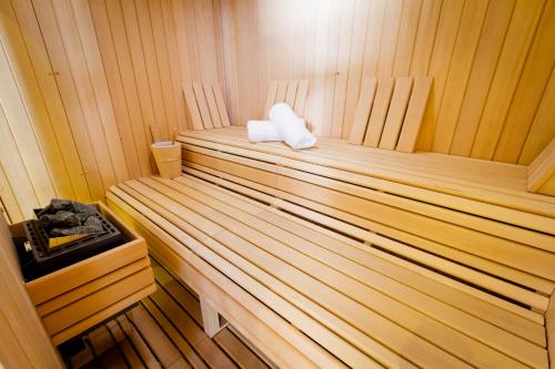 a inside of a sauna with two towels in it at Hôtel et Spa La Villa K - Basel Airport in Saint-Louis