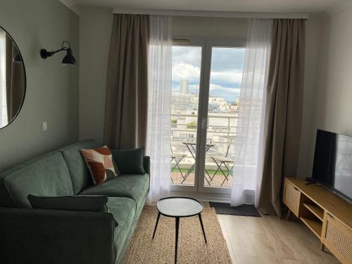 Χώρος καθιστικού στο Cosy Apartment in La Défense