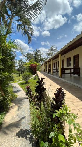 a courtyard of a building with trees and plants at Hotel Fazenda Ceu Aberto in Gravatá