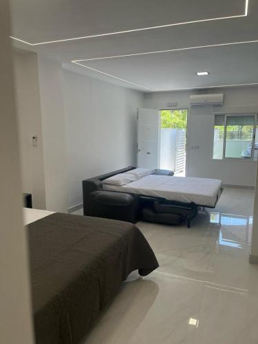 a bedroom with two beds in a room at Villa Amir in Fuengirola