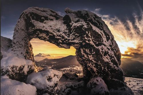 a statue of an eagle on top of a snow covered mountain at Le Galussel Gite d'étape et de séjour in Saint-Sébastien