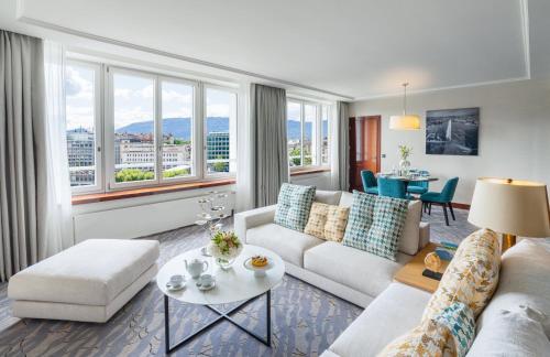 a living room with a couch and a table at Mandarin Oriental, Geneva in Geneva