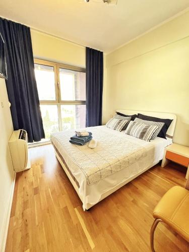 Ένα ή περισσότερα κρεβάτια σε δωμάτιο στο Harmonia Orange Apartment