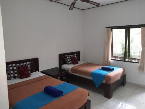 Ένα ή περισσότερα κρεβάτια σε δωμάτιο στο Star East Bungalows