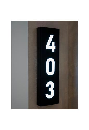 a black alarm clock with the number on it at Hotel Pernoca in Durrës