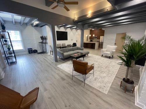 a large living room with a couch and a table at Downtown Vibes 2BR Parking Bikes in Richmond