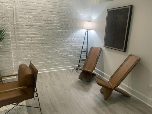 a room with two chairs and a table and a lamp at Downtown Vibes 2BR Parking Bikes in Richmond