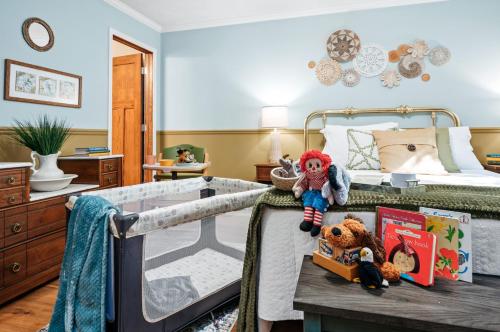 a bedroom with a bed with stuffed animals on a table at Lake Front-fishing-all sports Bass Lake Sanctuary in Traverse City
