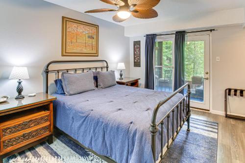 a bedroom with a bed and a ceiling fan at Hot Springs Retreat with Private Dock and Hot Tub! in Hot Springs