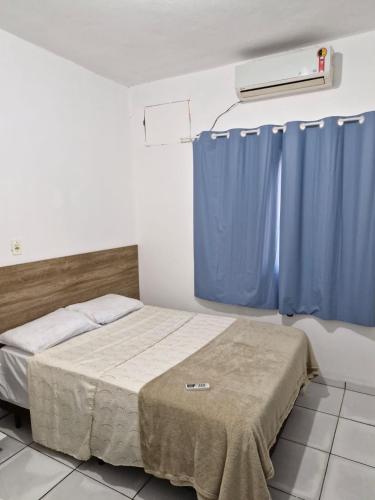 Ένα ή περισσότερα κρεβάτια σε δωμάτιο στο Lugar Perfeito