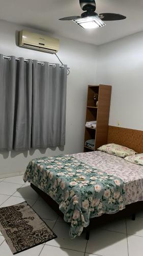 Ένα ή περισσότερα κρεβάτια σε δωμάτιο στο Lugar Perfeito