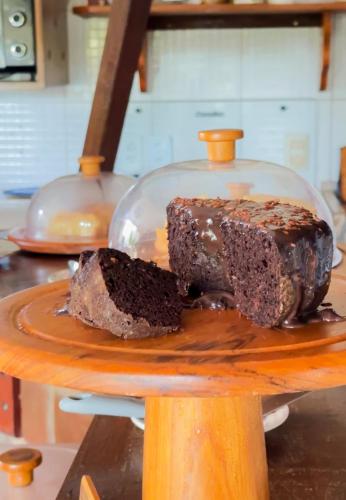 a chocolate cake sitting on top of a plate at Pousada Morada do Sol in Jericoacoara