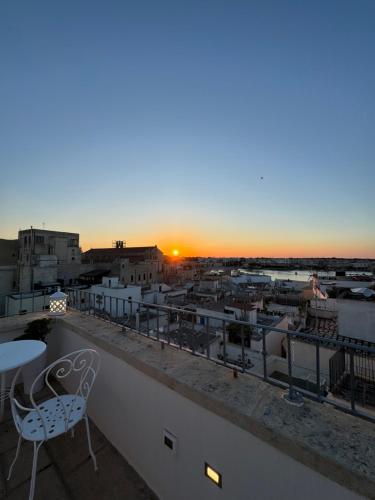 a view of the sunset from the balcony of a building at San Pietro Otranto in Otranto