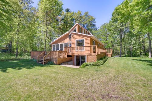 a cabin in the woods with a large yard at Private Beach and Deck Spacious Lake Michigan Home in Menominee