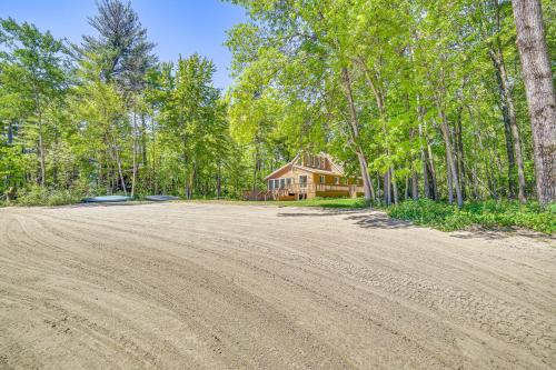 an empty dirt road in front of a house at Private Beach and Deck Spacious Lake Michigan Home in Menominee