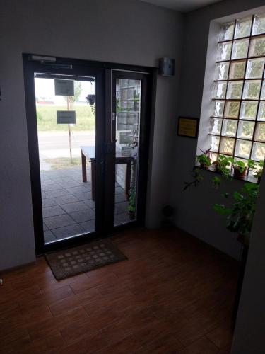 an entrance to a room with a door and a table at Randevu in Caracal