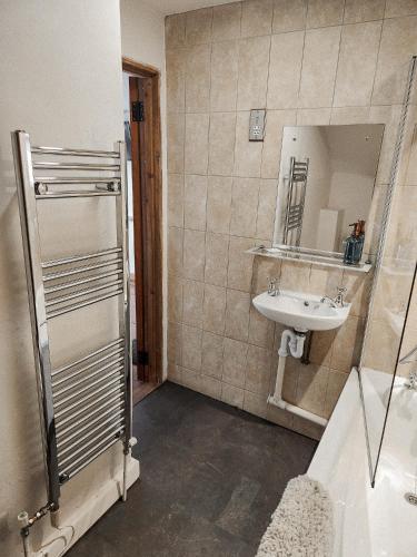 a bathroom with a sink and a mirror at The New Inn in Yeovil