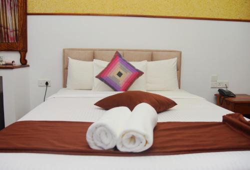 Ένα ή περισσότερα κρεβάτια σε δωμάτιο στο The Peak Ella