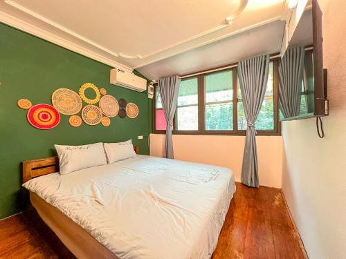 Postel nebo postele na pokoji v ubytování Bamboo Home