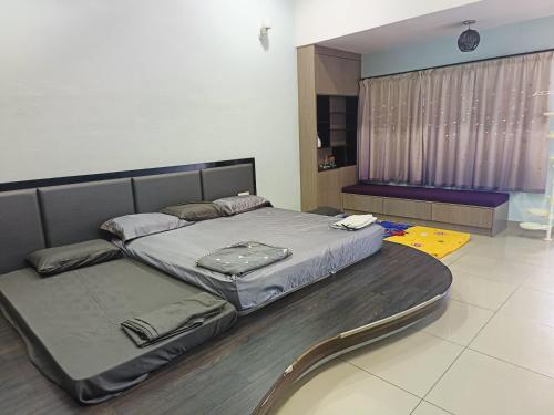 a large bed sitting in a room with at perdana homestay in Ipoh
