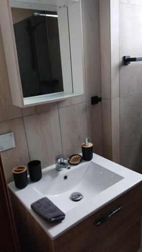 a bathroom sink with two cups on top of it at Apartmento START Complex Amaya Fuerteventura in Costa de Antigua