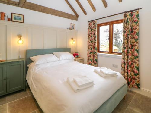 Postel nebo postele na pokoji v ubytování Bay Tree Cottage