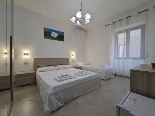 Ένα ή περισσότερα κρεβάτια σε δωμάτιο στο Fabiana's Rooms