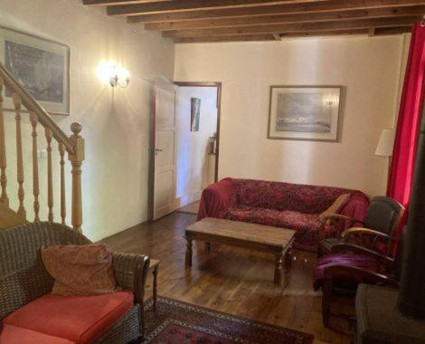 a living room with a couch and a table at Gite Carlit in Prades