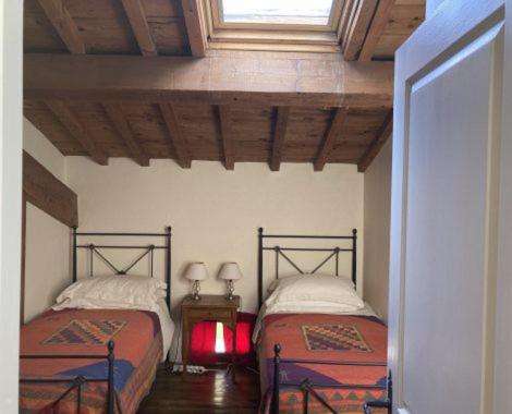 a bedroom with two beds in a room at Gite Carlit in Prades
