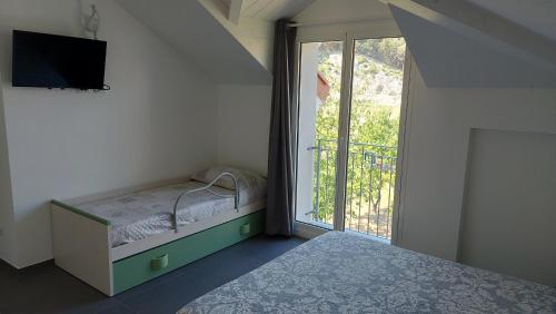 Un pat sau paturi într-o cameră la B&B La casa al mare di MatiGiò "Camera M"
