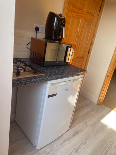 a microwave sitting on top of a kitchen counter at The perfect rest place in Omagh