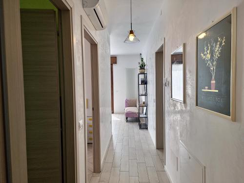 a hallway with a door leading to a living room at HERON Apartment in Scardovari