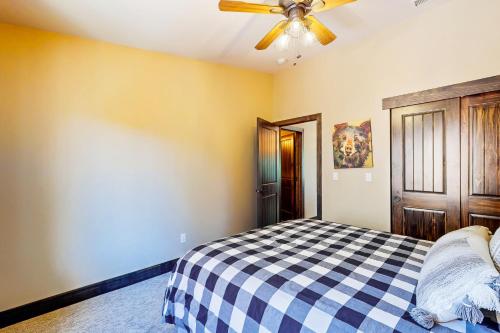a bedroom with a bed and a ceiling fan at Pooewin Place in South Lake Tahoe