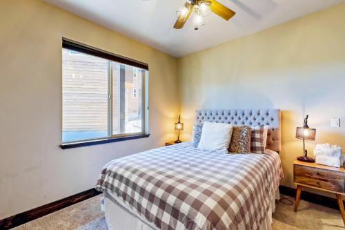 a bedroom with a bed and a window in it at Pooewin Place in South Lake Tahoe