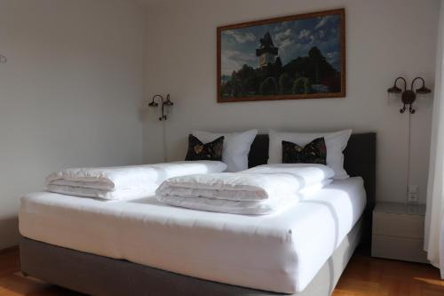 Una cama o camas en una habitación de Gasthof Lend-Platzl