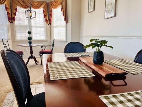 a dining room with a table with a plant on it at Nordic Village Condominium Resort in Jackson