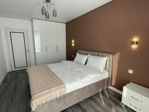 Postel nebo postele na pokoji v ubytování City View Apartment