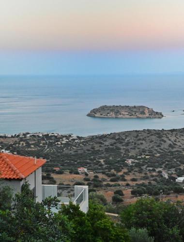 a view of a small island in the ocean at Aurora Spinalonga Garden Cottage in Chavgas