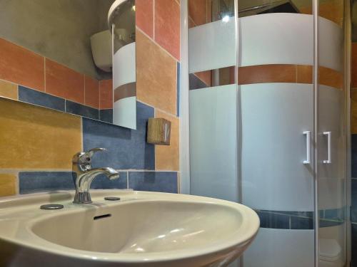 a bathroom with a sink and a shower at Wiki Hostel Colive in Zagarolo
