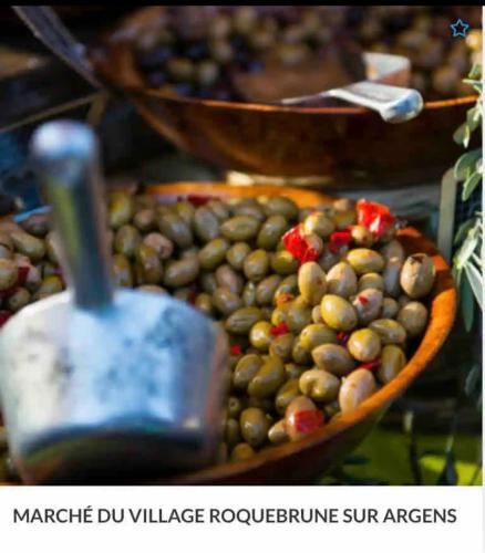 a large bowl of olives on a table at Maison Isal in Roquebrune-sur-Argens