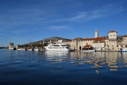 a group of boats are docked in a harbor at Apartment Ursus in Trogir