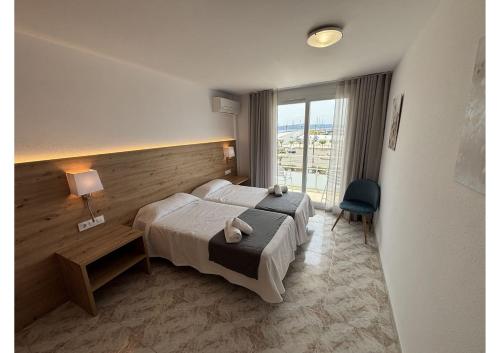 Postel nebo postele na pokoji v ubytování Hostal Santa Clara