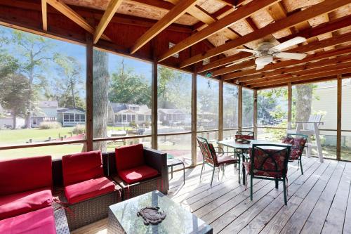 a screened in porch with a couch and a table at Ocean Parkway 289 in Ocean Pines