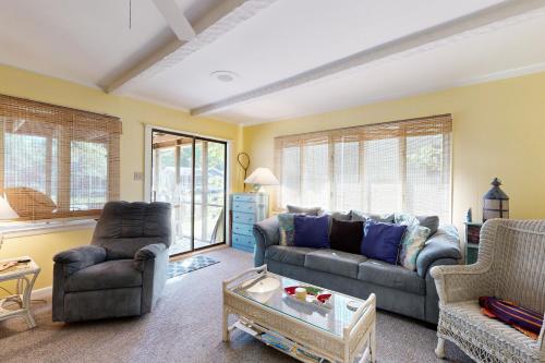 a living room with a couch and two chairs at Ocean Parkway 289 in Ocean Pines