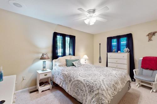 a bedroom with a bed and a ceiling fan at Ocean Parkway 289 in Ocean Pines